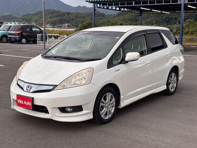 フィットシャトルハイブリッド ハイブリッド・スマートセレクション　ファインライン　メモリーナビ　ワンセグＴＶ　リアカメラ　スマートキー　ＨＩＤヘッドライト　シートヒーター　クルコン　社外１５インチアルミ　ＥＴＣ（6枚目）