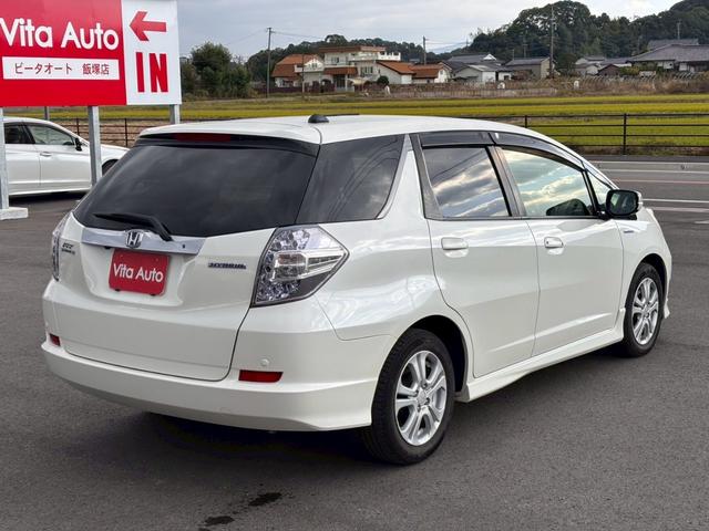 フィットシャトルハイブリッド ハイブリッド・スマートセレクション　ファインライン　メモリーナビ　ワンセグＴＶ　リアカメラ　スマートキー　ＨＩＤヘッドライト　シートヒーター　クルコン　社外１５インチアルミ　ＥＴＣ（14枚目）