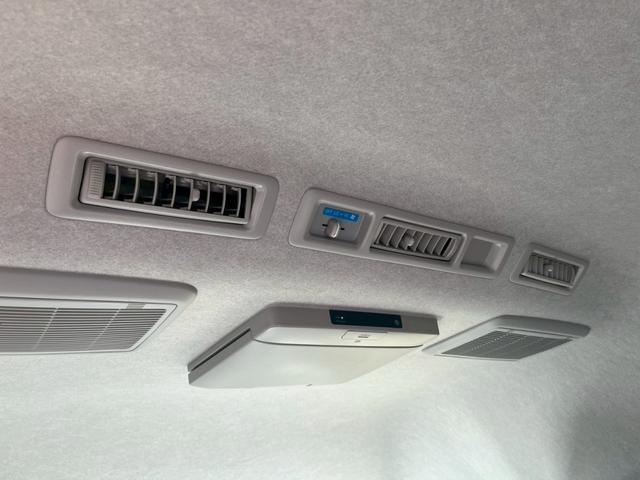 ハイエースコミューター スーパーロングGL 純正SDナビ 純正フリップダウンモニター11インチ 純正ドラレコ ビルドインETC モデリスタフロントスポイラー ソナー 純正アルミホイール15インチ リヤクーラー リヤヒーター チップアップシート(28枚目)