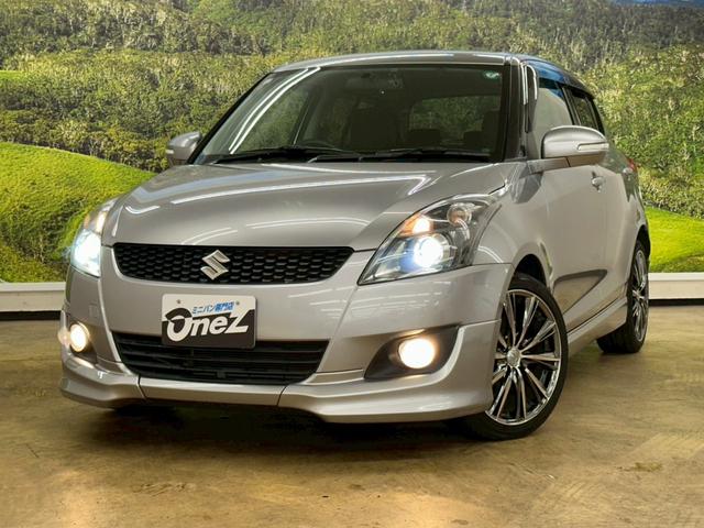 スイフト RS 社外ナビ・フルセグ・社外17インチアルミ・オートエアコン・HIDヘッドライト・ETC・スマートキー・プッシュスタート・バックモニター・純正エアロ・クルーズコントロール・革巻きステアリング・パドルシフト(4枚目)