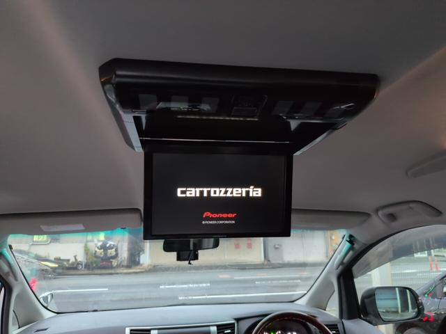 ヴェルファイア ２．４Ｚ　プラチナセレクションＩＩ　両側自動　スマートキー　両側パワースライドドア　電動リアゲート　プッシュスタート　ＥＴＣ　オートエアコン　純正アルミ　フリップダウンモニター　カロッツェリアナビ　フルセグＴＶ　バックカメラ　オットマン　スマートキー（26枚目）