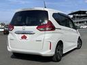 フリードハイブリッド ハイブリッド・Gホンダセンシング 禁煙車/ホンダセンシング/モデューロフロントバンパー/両側パワースライドドア/純正メモリーナビ/バックカメラ/BTオーディオ/ETC/スマートキー/LEDヘッドライト/アダプティブクルーズコントロール(4枚目)