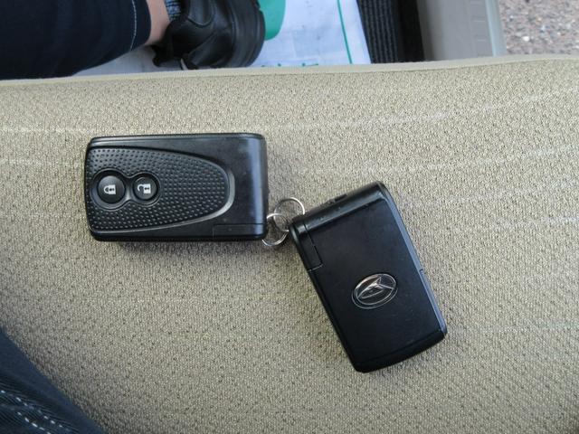 ムーヴ Ｘリミテッド　衝突安全ボディ　スマートキー　純正ワンセグＴＶナビ　バックカメラ　シャンパンゴールドメタリック　ハロゲンヘッドライト　アイドリングストップ　純正１４インチアルミホイール　ＡＢＳ　２ＷＤ　６６０（20枚目）