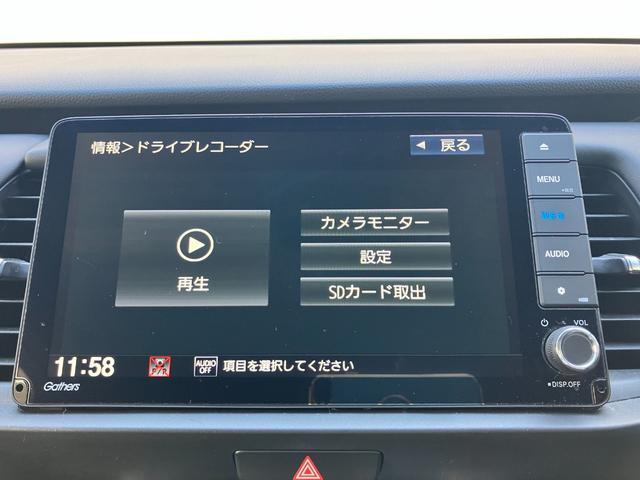 フィット e:HEVリュクス ACCフルセグナビLEDヘッドフォグRカメラETCナビ連動ドラレコ運転席助手席シートヒーター電制PパーキングセンサーオートブレーキホールドBTミュージックラックCDDVD再生ステアリングヒーター(23枚目)