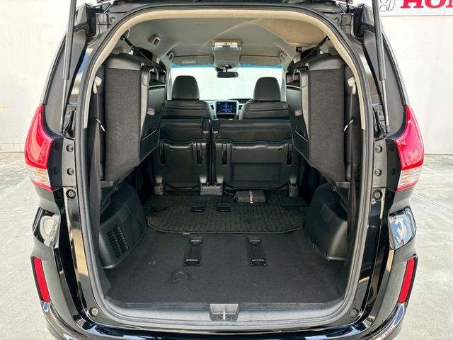 フリードハイブリッド ハイブリッド・Ｇホンダセンシング　ＡＣＣフルセグナビＬＥＤヘッドＲカメラＥＴＣサイドカーテンエアバッグＲモニター両側パワスラ運転席助手席シートヒーターＢＴミュージックラックＣＤＤＶＤ再生純正アルミ本革巻きステアリングスマキー（10枚目）