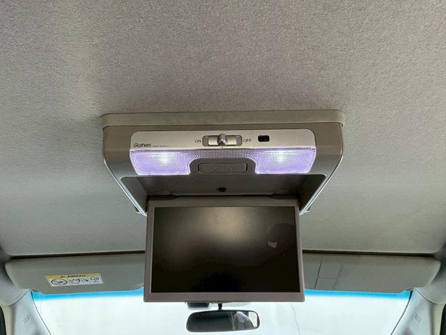 フリードハイブリッド ハイブリッド・Ｇホンダセンシング　ＡＣＣフルセグナビＬＥＤヘッドＲカメラＥＴＣサイドカーテンエアバッグＲモニター両側パワスラ運転席助手席シートヒーターＢＴミュージックラックＣＤＤＶＤ再生純正アルミ本革巻きステアリングスマキー（13枚目）