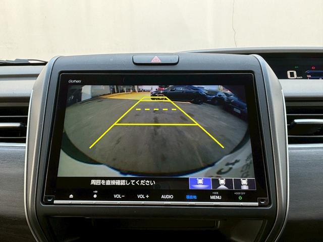 フリードハイブリッド ハイブリッド・Ｇホンダセンシング　ＡＣＣフルセグナビＬＥＤヘッドＲカメラＥＴＣサイドカーテンエアバッグＲモニター両側パワスラ運転席助手席シートヒーターＢＴミュージックラックＣＤＤＶＤ再生純正アルミ本革巻きステアリングスマキー（16枚目）