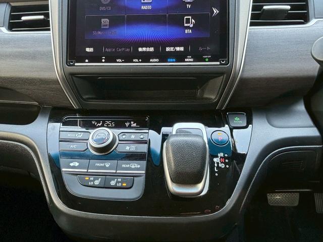 フリードハイブリッド ハイブリッド・Ｇホンダセンシング　ＡＣＣフルセグナビＬＥＤヘッドＲカメラＥＴＣサイドカーテンエアバッグＲモニター両側パワスラ運転席助手席シートヒーターＢＴミュージックラックＣＤＤＶＤ再生純正アルミ本革巻きステアリングスマキー（17枚目）