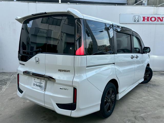 ステップワゴンスパーダ ｅ：ＨＥＶスパーダＧ・ＥＸホンダセンシング　ＡＣＣフルセグナビＬＥＤヘッドフォグＲカメラＥＴＣナビ連動ドラレコ両側パワスラ電制Ｐオートブレーキホールド純正アルミＢＴミュージックラックＣＤＤＶＤ再生トリプルゾーンエアコン（5枚目）