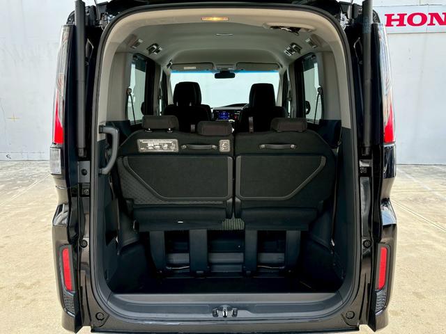 ステップワゴンスパーダ スパーダホンダセンシング ACCフルセグナビLEDヘッドフォグRカメラETCオートエアコンリアマニュアルクーラー両側パワスラBTミュージックラックCDDVD再生USBパドルシフト本革巻きシートバックテーブル純正アルミスマキー(11枚目)