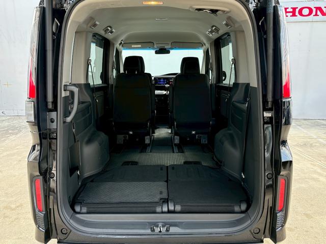 ステップワゴンスパーダ スパーダホンダセンシング ACCフルセグナビLEDヘッドフォグRカメラETCオートエアコンリアマニュアルクーラー両側パワスラBTミュージックラックCDDVD再生USBパドルシフト本革巻きシートバックテーブル純正アルミスマキー(12枚目)