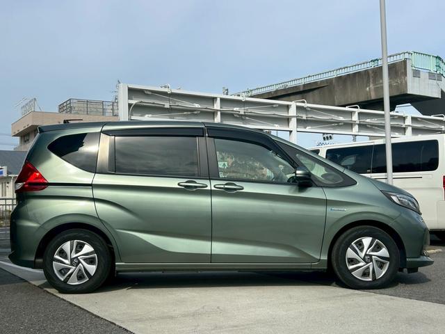 フリードハイブリッド ハイブリッド・Gホンダセンシング 禁煙 純正ナビ/VXM-217VFNi フルセグテレビ バックカメラ シートヒーター 両側パワースライドドア ETC レーダークルーズ レーンキープ 衝突軽減システム スマートキー(12枚目)
