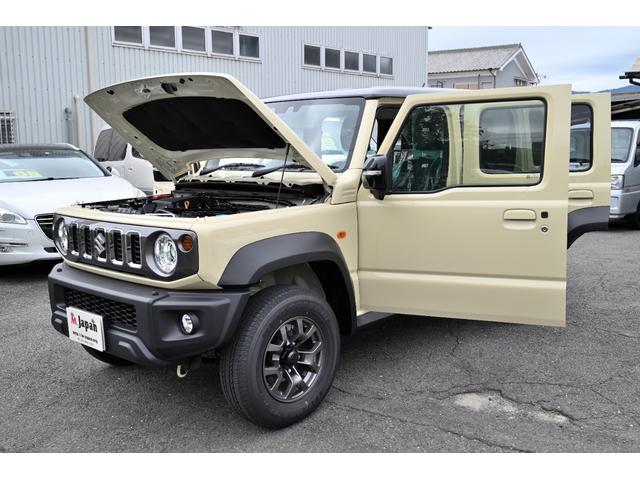 ジムニーノマド ＦＣ　登録済未使用車　スズキセイフティーサポート　パートタイム４ＷＤ　　ＯＰカラー　シフォンアイボリー／ブラック２　レーダークルーズ　禁煙車　コーナーセンサー　スマートキー　ＬＥＤヘッド　　車線逸脱警報（2枚目）