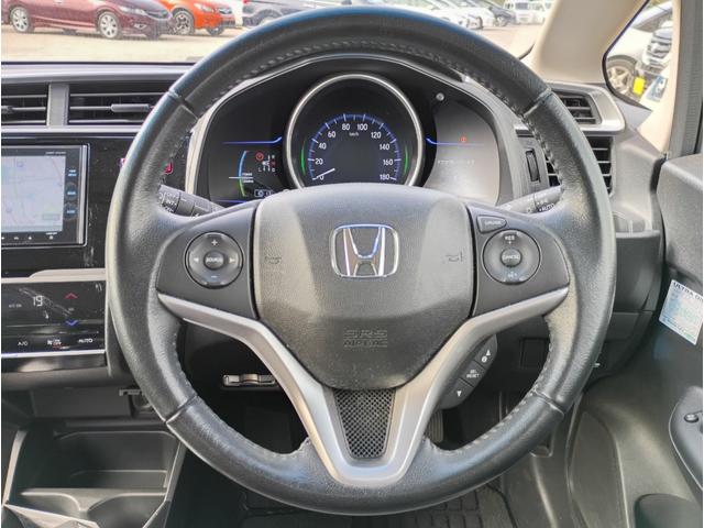 フィットハイブリッド Ｌパッケージ　メモリーナビ　フルセグＴＶ　リアカメラ　スマートキー　ＨＩＤヘッドライト　Ｂｌｕｅｔｏｏｔｈ　クルコン　純正１５インチアルミ　ＥＴＣ（19枚目）