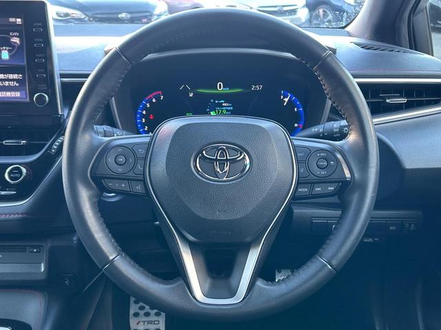カローラスポーツ ハイブリッドG Z TRDフルエアロ 禁煙車 プリクラッシュセーフティ 純正ディスプレイオーディオ バックカメラ シートヒーター レーダークルーズ ETC 革巻きハンドル 純正18インチアルミ スマートキー(12枚目)