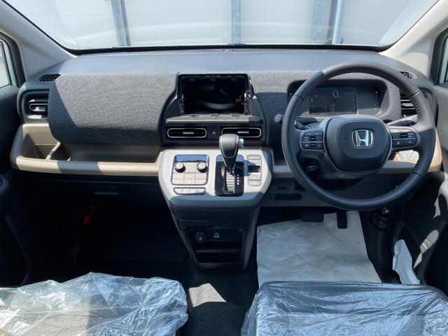 フリード e:HEVエアー EX 登録済未使用車 ホンダセンシング LEDヘッドライト 両側パワースライドドア シートヒーター リアクーラー バックカメラ アクティブクルーズコントロール スマートキー 15インチアルミホイル(28枚目)