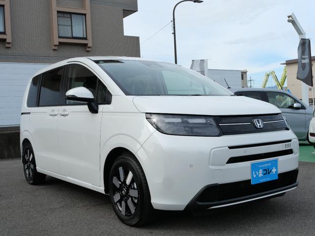 フリード e:HEVエアーEX 登録済未使用車 【いまコレ+】新品ナビ、新品マット ホンダセンシング 9インチナビ バックカメラ ETC2.0 2列目USB充電器 両側電動スライド シートヒーター 電子パーキング LEDヘッドライト(9枚目)