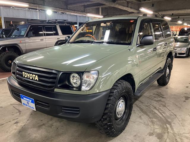ランドクルーザー100 VXリミテッド カーキ全塗装済 丸目ヘッド換装 DEAN16インチAW TOYOオープンカントリーMTタイヤ TOYOTAグリル サイドステップ ウッドコンビステア SDナビTVバックカメラ シートカバー キーレス(4枚目)