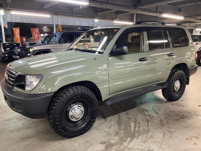ランドクルーザー100 VXリミテッド カーキ全塗装済 丸目ヘッド換装 DEAN16インチAW TOYOオープンカントリーMTタイヤ TOYOTAグリル サイドステップ ウッドコンビステア SDナビTVバックカメラ シートカバー キーレス(5枚目)