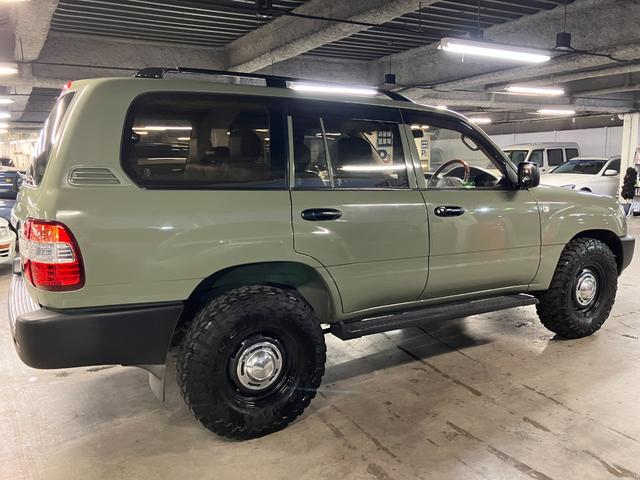 ランドクルーザー100 VXリミテッド カーキ全塗装済 丸目ヘッド換装 DEAN16インチAW TOYOオープンカントリーMTタイヤ TOYOTAグリル サイドステップ ウッドコンビステア SDナビTVバックカメラ シートカバー キーレス(10枚目)