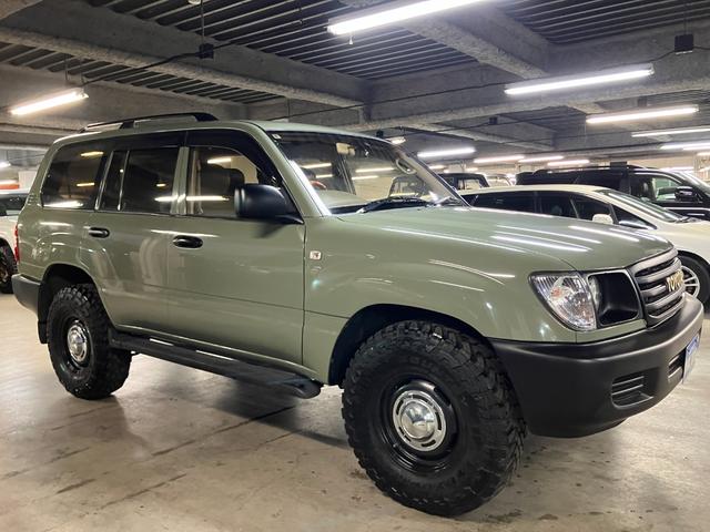 ランドクルーザー100 VXリミテッド カーキ全塗装済 丸目ヘッド換装 DEAN16インチAW TOYOオープンカントリーMTタイヤ TOYOTAグリル サイドステップ ウッドコンビステア SDナビTVバックカメラ シートカバー キーレス(11枚目)