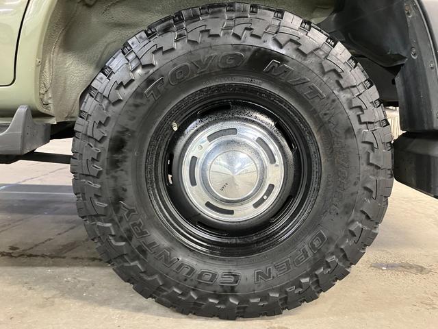 ランドクルーザー100 VXリミテッド カーキ全塗装済 丸目ヘッド換装 DEAN16インチAW TOYOオープンカントリーMTタイヤ TOYOTAグリル サイドステップ ウッドコンビステア SDナビTVバックカメラ シートカバー キーレス(15枚目)