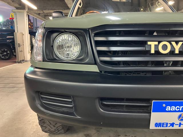 ランドクルーザー100 VXリミテッド カーキ全塗装済 丸目ヘッド換装 DEAN16インチAW TOYOオープンカントリーMTタイヤ TOYOTAグリル サイドステップ ウッドコンビステア SDナビTVバックカメラ シートカバー キーレス(18枚目)