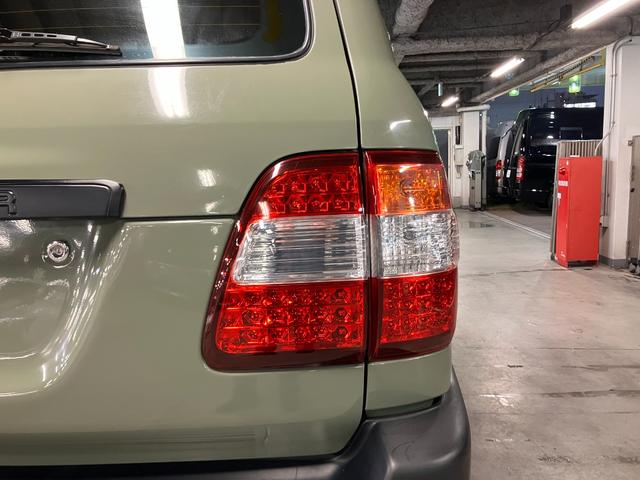 ランドクルーザー100 VXリミテッド カーキ全塗装済 丸目ヘッド換装 DEAN16インチAW TOYOオープンカントリーMTタイヤ TOYOTAグリル サイドステップ ウッドコンビステア SDナビTVバックカメラ シートカバー キーレス(23枚目)