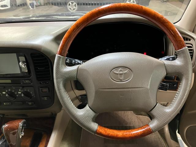 ランドクルーザー100 VXリミテッド カーキ全塗装済 丸目ヘッド換装 DEAN16インチAW TOYOオープンカントリーMTタイヤ TOYOTAグリル サイドステップ ウッドコンビステア SDナビTVバックカメラ シートカバー キーレス(27枚目)