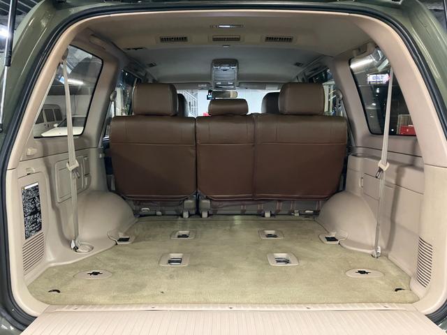ランドクルーザー100 VXリミテッド カーキ全塗装済 丸目ヘッド換装 DEAN16インチAW TOYOオープンカントリーMTタイヤ TOYOTAグリル サイドステップ ウッドコンビステア SDナビTVバックカメラ シートカバー キーレス(56枚目)
