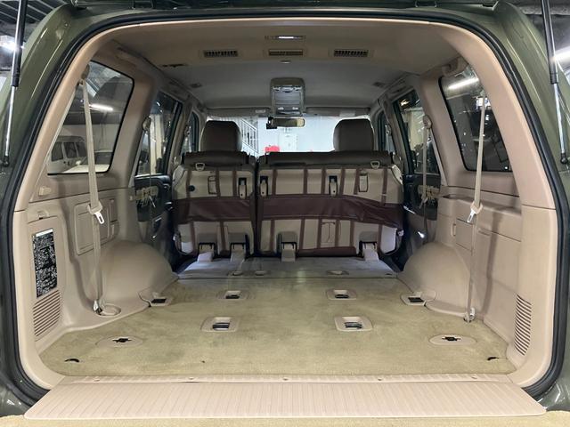 ランドクルーザー100 VXリミテッド カーキ全塗装済 丸目ヘッド換装 DEAN16インチAW TOYOオープンカントリーMTタイヤ TOYOTAグリル サイドステップ ウッドコンビステア SDナビTVバックカメラ シートカバー キーレス(57枚目)