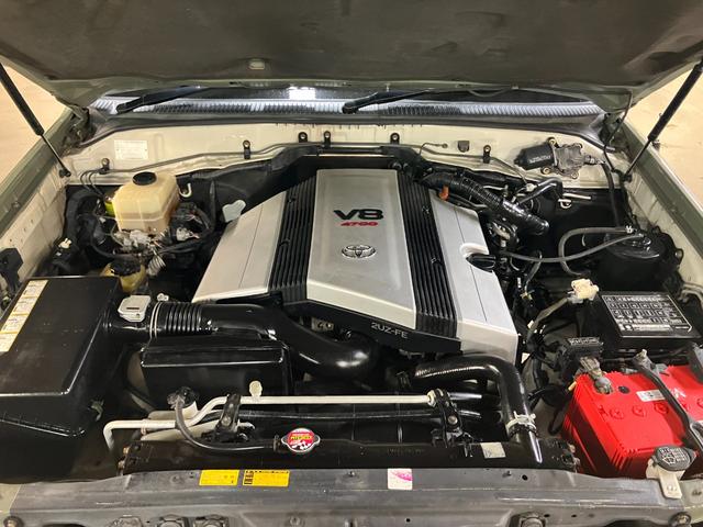ランドクルーザー100 VXリミテッド カーキ全塗装済 丸目ヘッド換装 DEAN16インチAW TOYOオープンカントリーMTタイヤ TOYOTAグリル サイドステップ ウッドコンビステア SDナビTVバックカメラ シートカバー キーレス(64枚目)