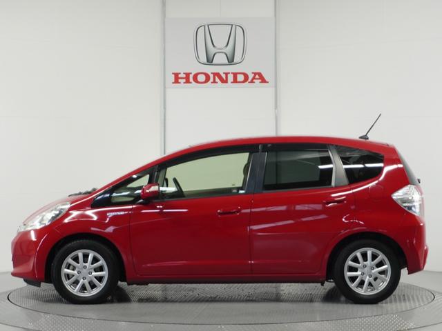 フィットハイブリッド スマートセレクション　純正ナビゲーション／バックカメラ／ワンセグＴＶ／ミュージックプレーヤー接続／ＤＶＤ再生／ＥＴＣ車載器／クルーズコントロール／スマートキー／オートエアコン／盗難防止システム／横滑り制御装置／電動格ミラー（13枚目）