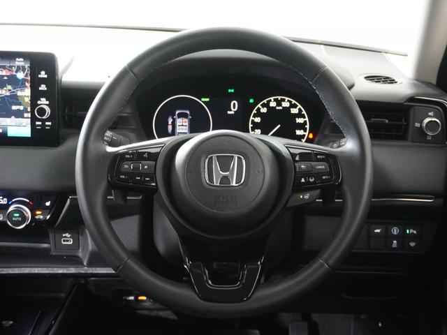 ヴェゼル ｅ：ＨＥＶＺ　１オ－ナ－ナビＤレコＲカメＥＴＣ２．０クルコン　渋滞追従クルーズ　Ｂｌｕｅｔｏｏｔｈ　ハンドルヒーター　障害物センサー　シートヒーター　ダウンヒルアシスト　デイライト　ブラインドスポット　禁煙車（10枚目）