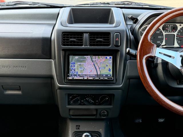 パジェロミニ Ｖ　凹みあり車両　売切御免　タイミングベルト交換　５ＭＴ　４ＷＤ　ナブゲーション　リフトアップ　社外アルミ　ターボタイマー　過給機メーター　キーレス　ＥＴＣ　オリジナル塗装（23枚目）