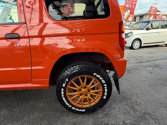 パジェロミニ Ｖ　凹みあり車両　売切御免　タイミングベルト交換　５ＭＴ　４ＷＤ　ナブゲーション　リフトアップ　社外アルミ　ターボタイマー　過給機メーター　キーレス　ＥＴＣ　オリジナル塗装（34枚目）