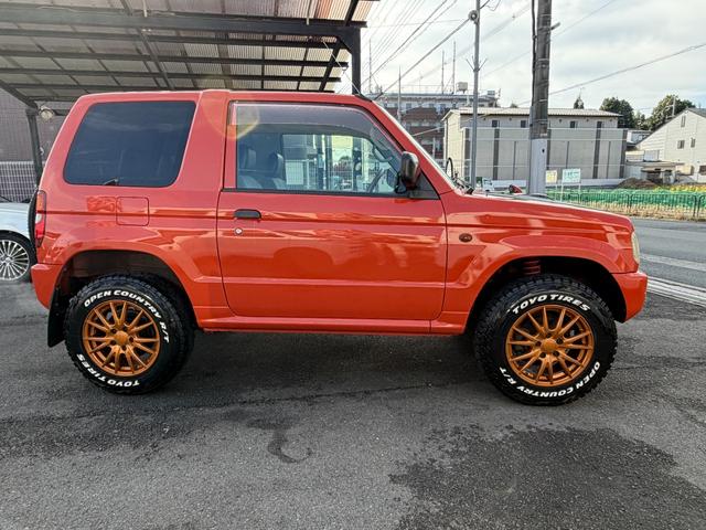 パジェロミニ Ｖ　凹みあり車両　売切御免　タイミングベルト交換　５ＭＴ　４ＷＤ　ナブゲーション　リフトアップ　社外アルミ　ターボタイマー　過給機メーター　キーレス　ＥＴＣ　オリジナル塗装（40枚目）