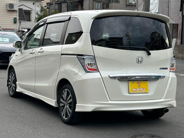 フリードハイブリッド ジャストセレクション　ユーザー買取　禁煙　純正ナビ　ワンセグ　Ｂカメラ　ＥＴＣ車載器　両側パワースライドドア　オートクルーズ　　スマートキー　前後ドライブレコーダー　ＨＩＤ　純正ＡＷ　フロアマット　ドアバイザー　スペアキー（4枚目）