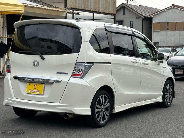 フリードハイブリッド ジャストセレクション　ユーザー買取　禁煙　純正ナビ　ワンセグ　Ｂカメラ　ＥＴＣ車載器　両側パワースライドドア　オートクルーズ　　スマートキー　前後ドライブレコーダー　ＨＩＤ　純正ＡＷ　フロアマット　ドアバイザー　スペアキー（6枚目）