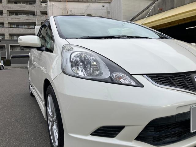 フィット RS ハイウェイエディション 純正ワンセグナビ ETC Bカメラ ユーザー買取車 禁煙車 キーレス スペアキー 社外16インチアルミホイール 純正フロアマット 純正ドアバイザー HIDヘッドライト オートエアコン ウインカーミラー(9枚目)