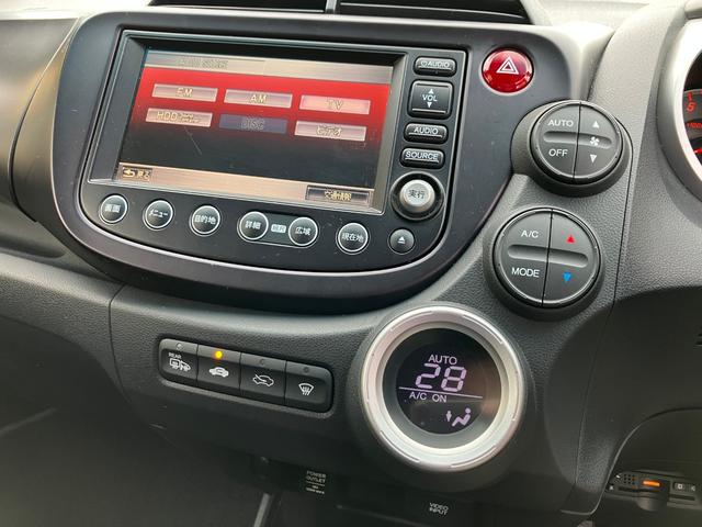 フィット RS ハイウェイエディション 純正ワンセグナビ ETC Bカメラ ユーザー買取車 禁煙車 キーレス スペアキー 社外16インチアルミホイール 純正フロアマット 純正ドアバイザー HIDヘッドライト オートエアコン ウインカーミラー(29枚目)