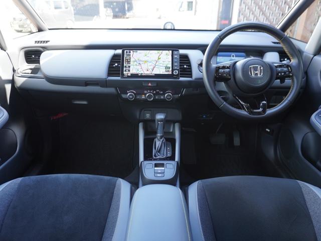 フィット ｅ：ＨＥＶＲＳ　９インチプレミアムインターナビ／ドラレコ／ＥＴＣ／バックカメラ／アダプティブクルーズコントロール／Ｂｌｕｅｔｏｏｔｈ／パドルシフト／電子制御パーキングブレーキ／ドアバイザー／ＬＥＤヘッドライト／ＴＶ（2枚目）