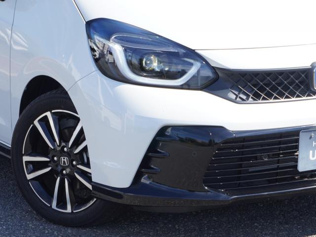 フィット ｅ：ＨＥＶＲＳ　９インチプレミアムインターナビ／ドラレコ／ＥＴＣ／バックカメラ／アダプティブクルーズコントロール／Ｂｌｕｅｔｏｏｔｈ／パドルシフト／電子制御パーキングブレーキ／ドアバイザー／ＬＥＤヘッドライト／ＴＶ（12枚目）