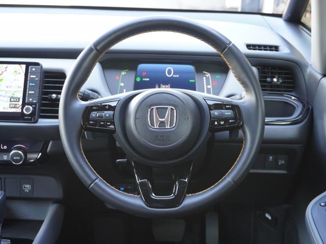 フィット ｅ：ＨＥＶＲＳ　９インチプレミアムインターナビ／ドラレコ／ＥＴＣ／バックカメラ／アダプティブクルーズコントロール／Ｂｌｕｅｔｏｏｔｈ／パドルシフト／電子制御パーキングブレーキ／ドアバイザー／ＬＥＤヘッドライト／ＴＶ（31枚目）