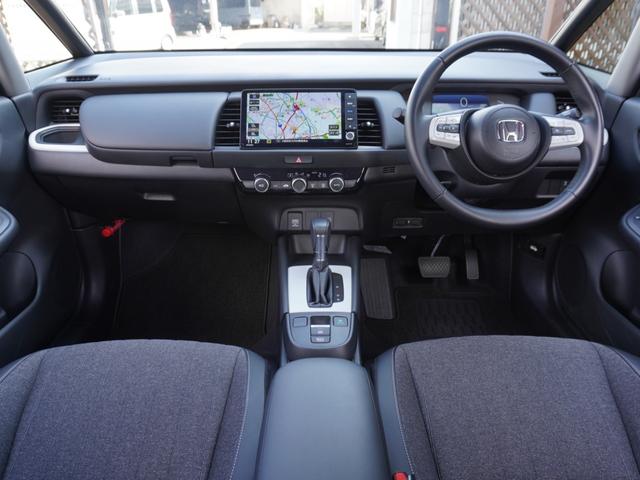 フィット e:HEVホーム 9インチプレミアムインターナビ/前後ドラレコ/ETC/バックカメラ/アダプティブクルーズコントロール/Bluetooth/KLEDヘッドライト/電子制御パーキングブレーキ/安全運転支援/TV/DVD(2枚目)