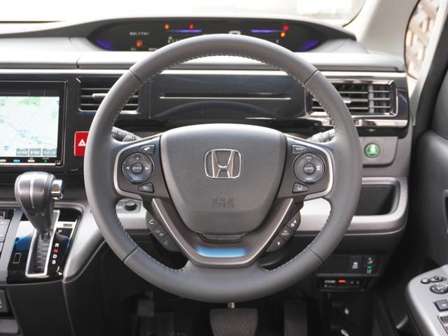 ステップワゴンスパーダ スパーダホンダセンシング　９インチプレミアムインターナビ／前後ドラレコ／ＥＴＣ／バックカメラ／両側電動スライドドア／アダプティブクルーズコントロール／Ｂｌｕｅｔｏｏｔｈ／パドルシフト／ロールサンシェード／後席用テーブル／ＴＶ（34枚目）
