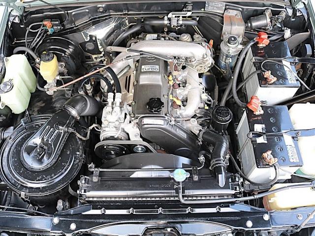 ランドクルーザープラド SXワイド アーバンカーキ全塗装 ナロー換装 パイオニア製ディスプレイオーディオ ヨコハマジオランダーX-ATタイヤ 輸出用鉄チンホイール ウッドコンビステアリング 3列目有 ノーマル車高 新品サイドエンブレム(12枚目)