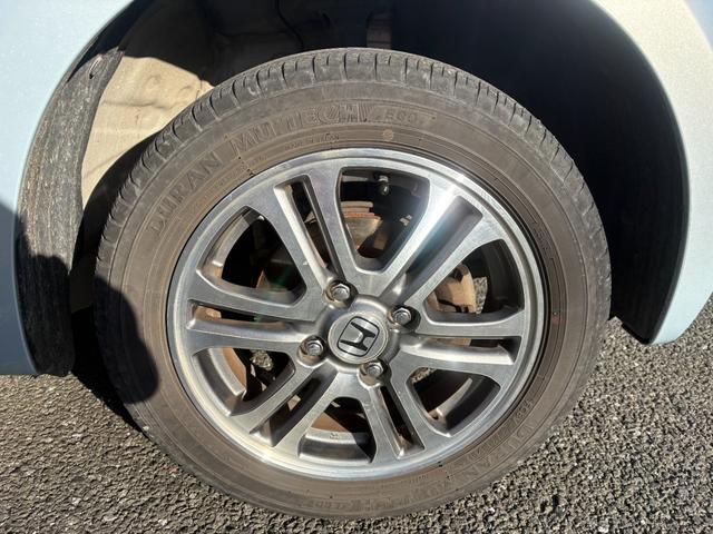 Ｎ－ＢＯＸ Ｇ・Ｌパッケージ　４ＷＤ　後席両側パワースライドドア　オートエアコン　電動格納ミラー　プッシュスタート　スマートキー　１４インチ純正アルミホイール　アイドリングストップ　ステアリングリモコン　ＣＤ再生（11枚目）