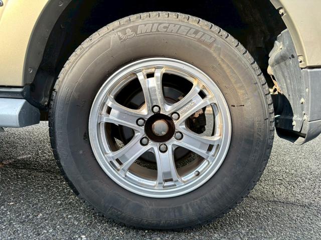 パジェロ ロング　エクシード　車検整備付・過去記録簿付・禁煙車・ロックフォードスピーカー・メーカーナビ・Ｂカメラ・フリップダウンモニター・ツートンカラー・ルーフレール・フロントフォグ・ＨＩＤ（54枚目）