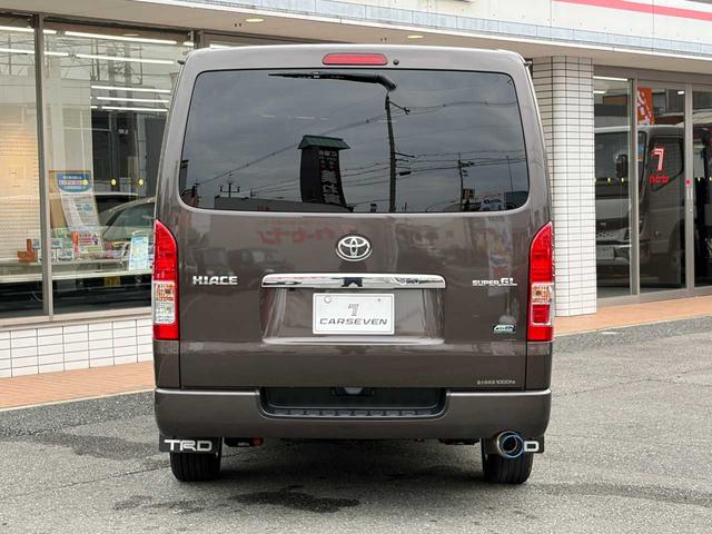 ハイエースバン スーパーGL 50TH アニバーサリーリミテッド 両側パワスラ 寒冷地仕様 TRDフロントスポイラー アルパインフローティングナビ、11.1型デジタルミラー、12.8インチフリップダウン 運転席レカロシート ユーアイビークルベッドキット(3枚目)